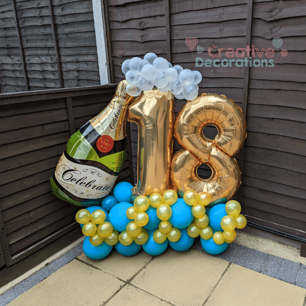 18th birthday balloon display in gold and turquoise