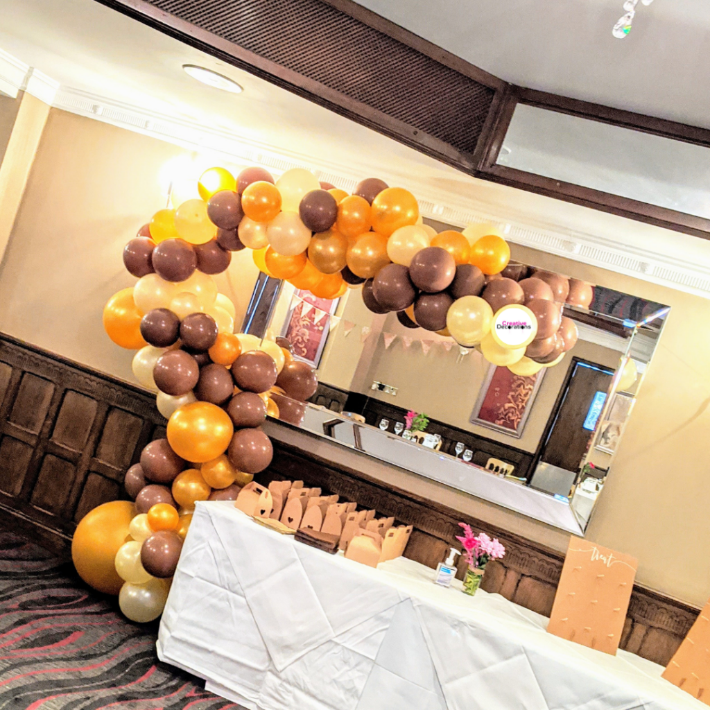 Brown and gold balloon garland