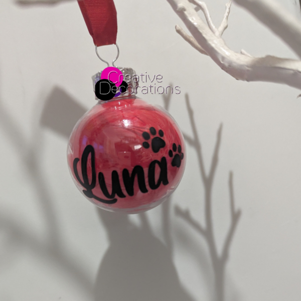 Personalised bauble filled with red feathers