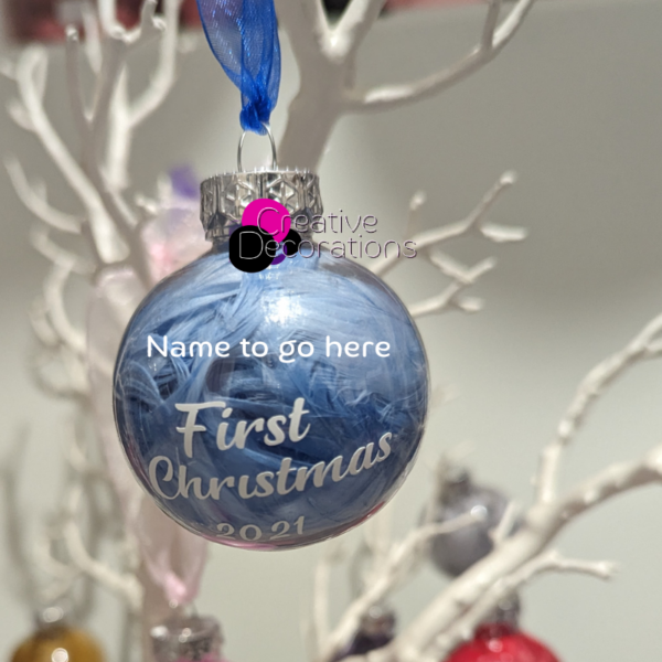 personalised babys first Christmas bauble filled with light blue feathers