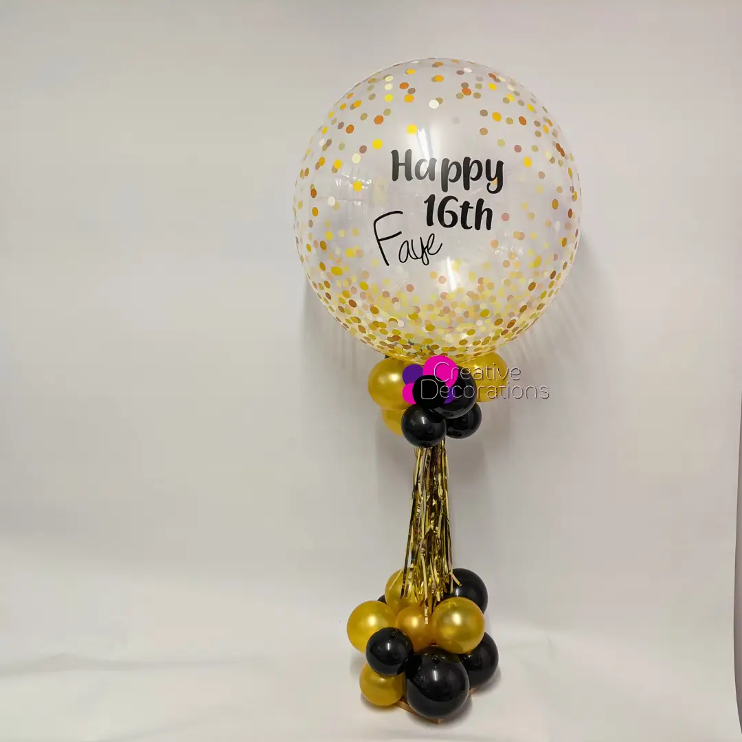 A 13th Birthday balloon display with confetti and tassels 